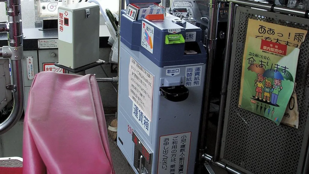 Fare display and payment equipment inside a Japanese local bus