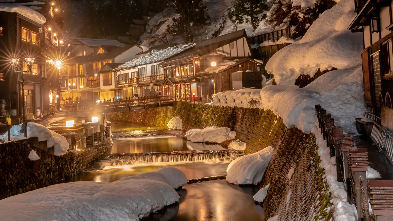 Snow-covered ryokan buildings in Ginzan Onsen