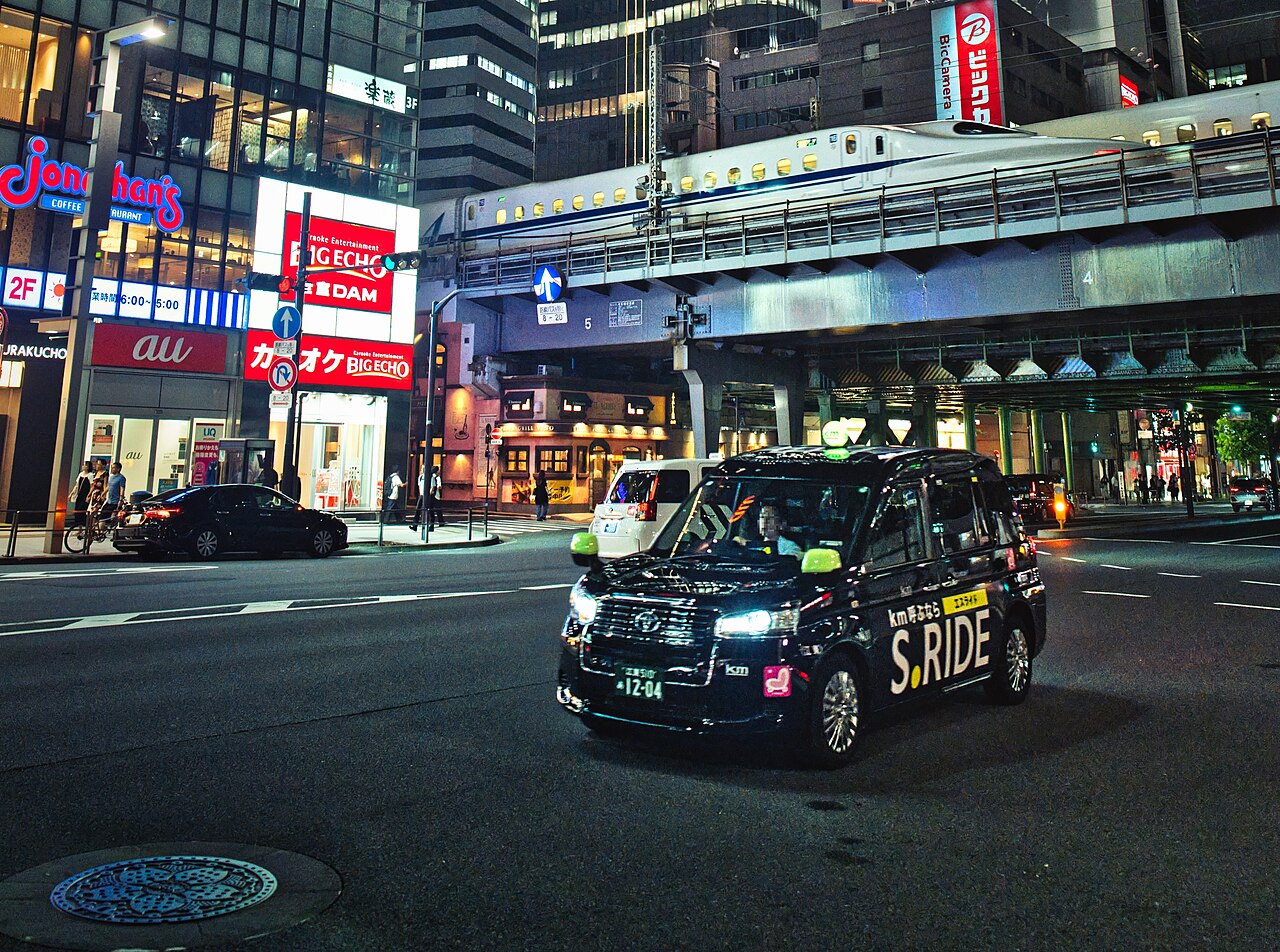A Tokyo taxi travelling through Yurakucho at night