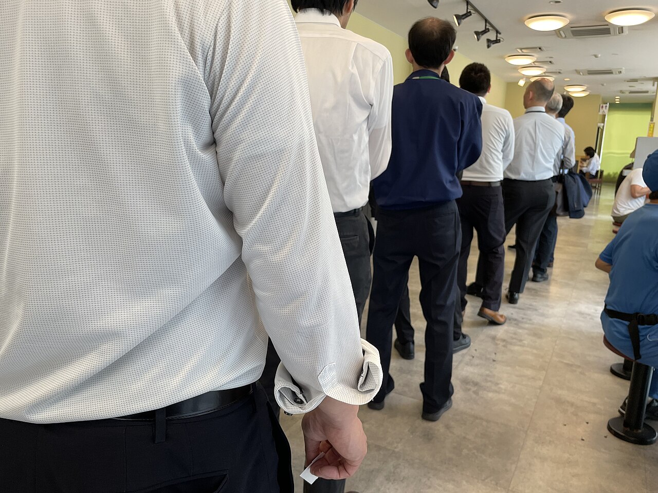 People waiting to enter a restaurant in Japan