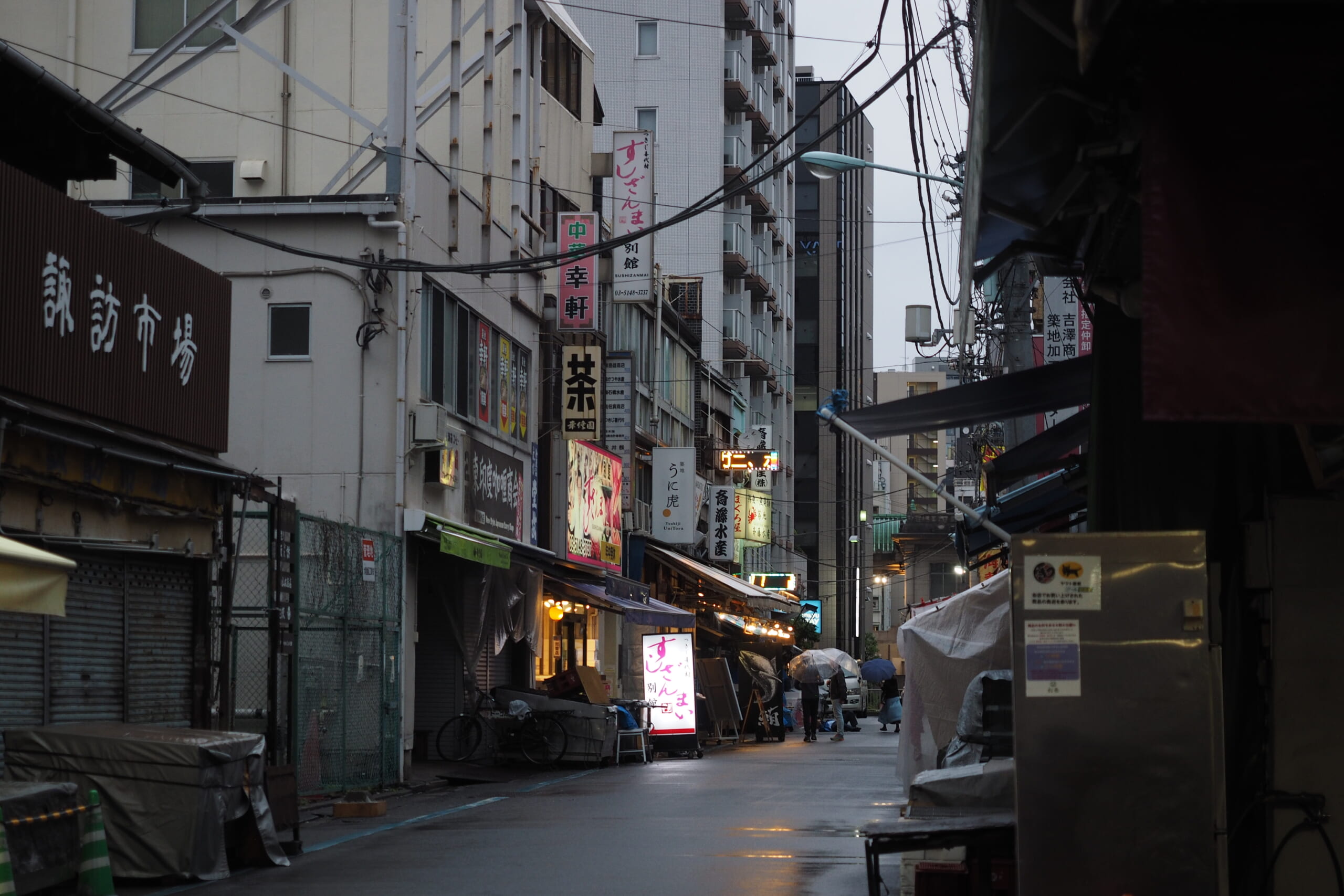 A narrow alley lined with shops at Tsukiji Outer Market