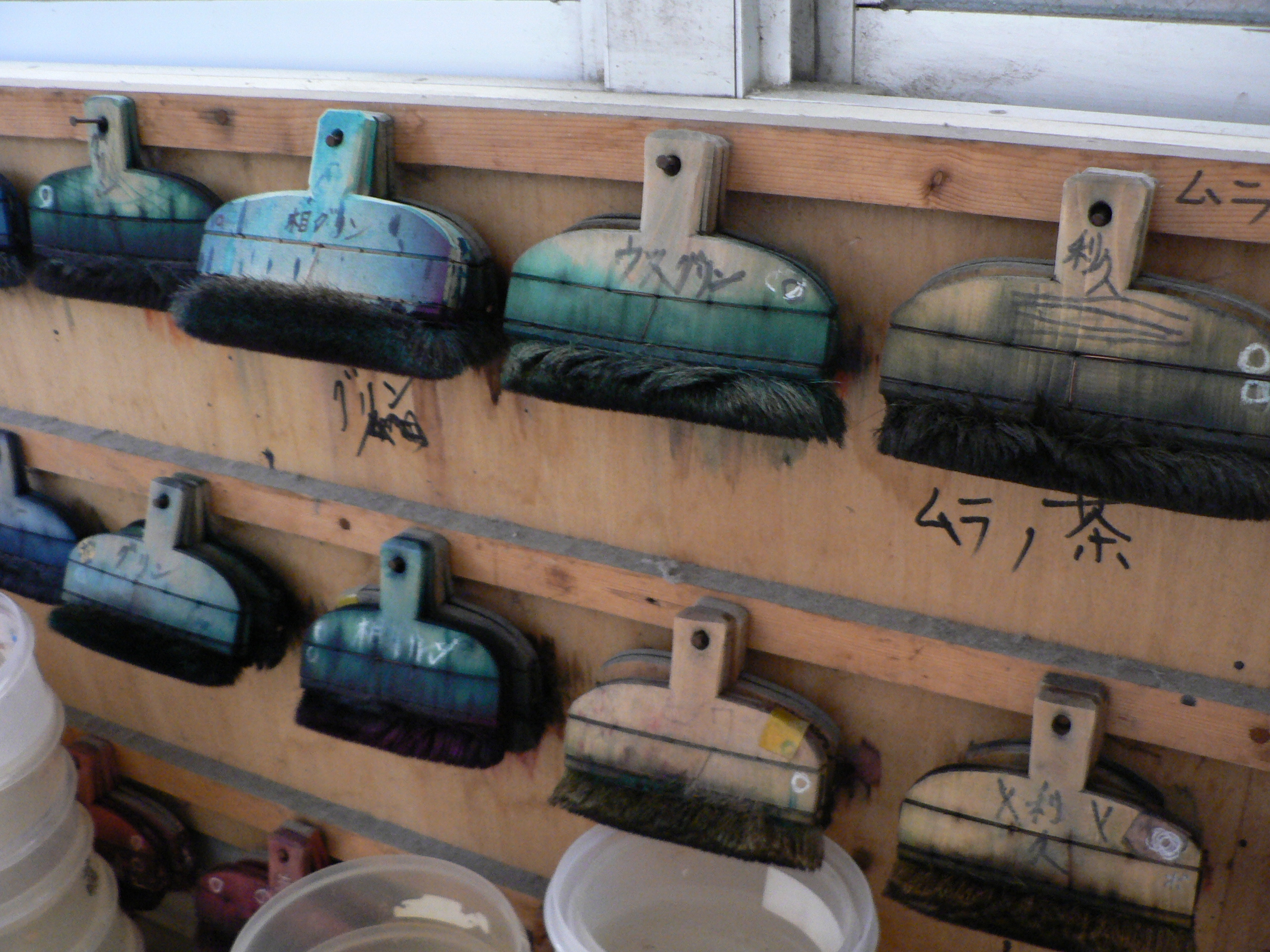 Colour-labelled brushes used by a katazome craftsman in Kyoto, a reference photograph