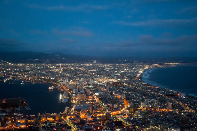 Hakodate city lights between two bays at dusk, viewed from Mount Hakodate