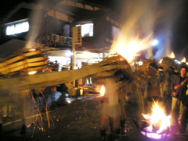 Torch bearers carrying a flaming torch at the Kurama Fire Festival