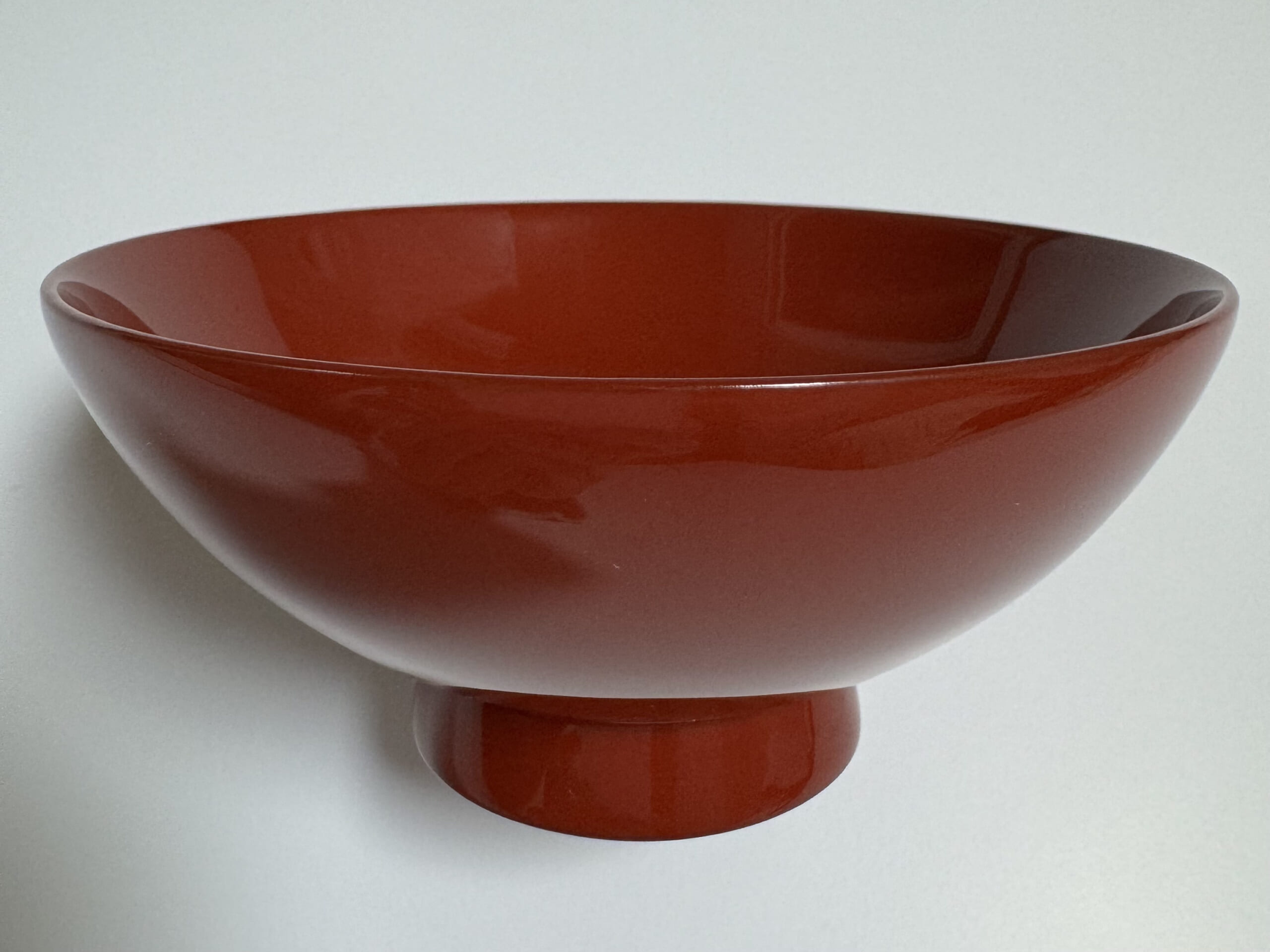 Red Wajima lacquer rice bowl, shown as a lacquerware reference