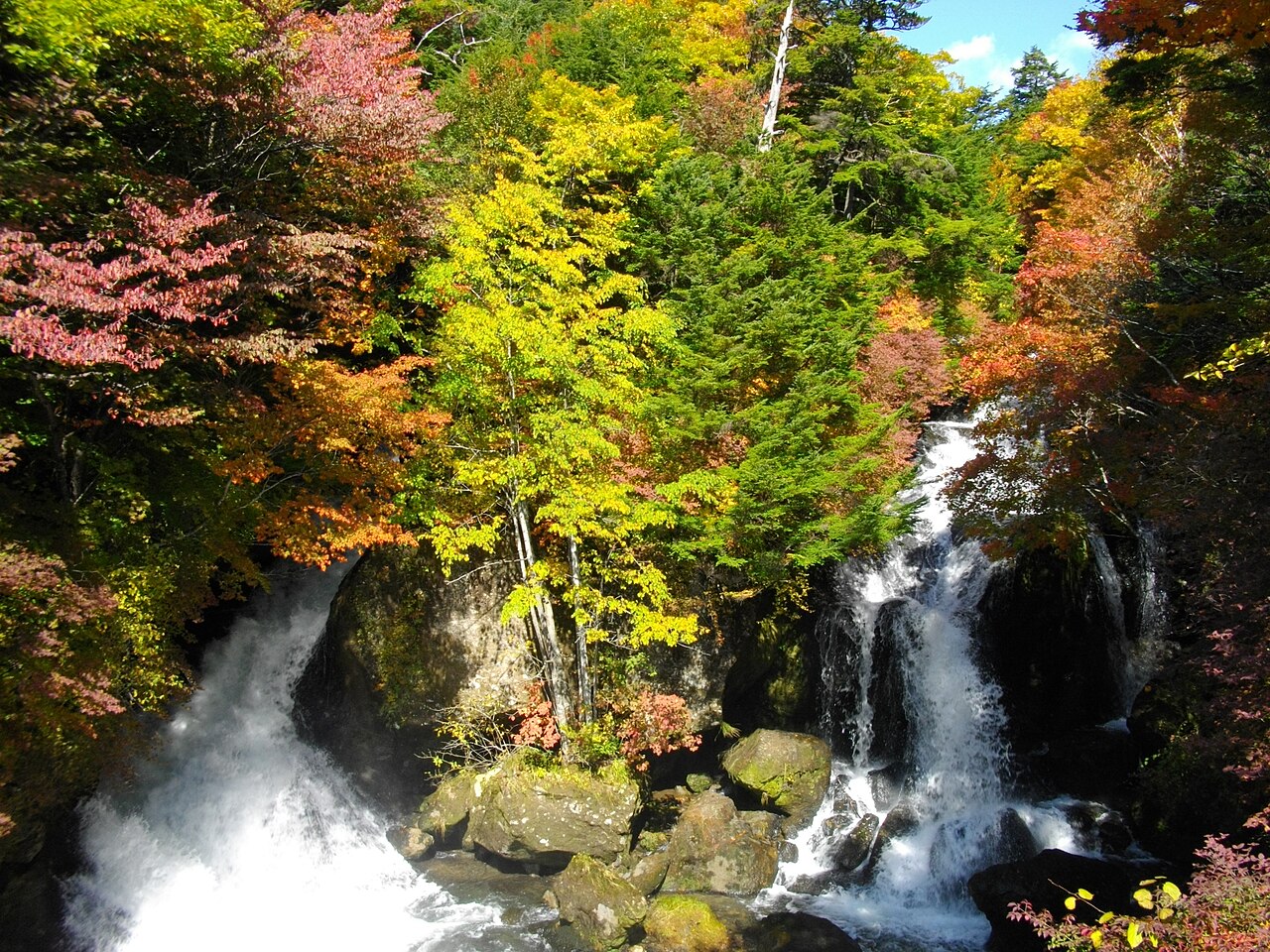 Ryuzu Falls flowing between autumn-coloured trees in Nikko