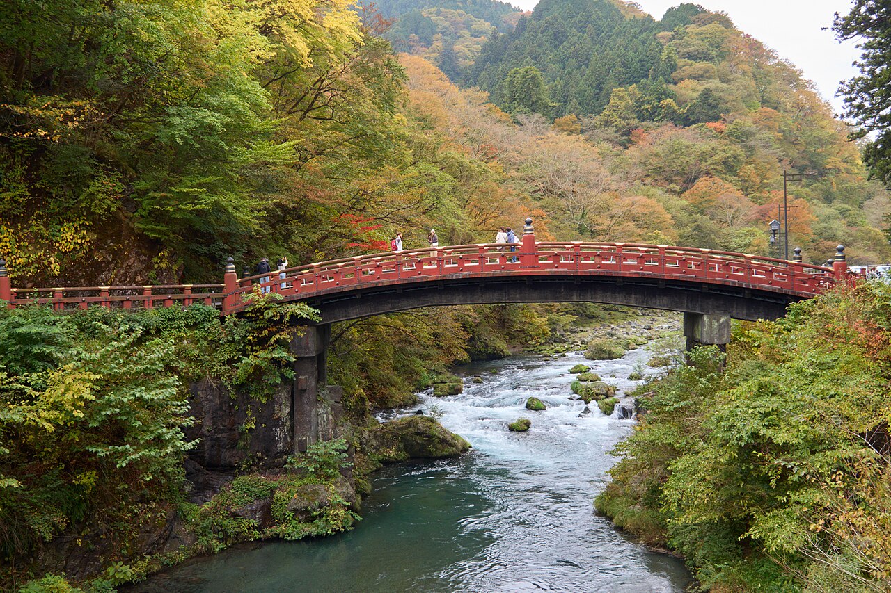 Nikko’s red Shinkyo Bridge surrounded by autumn foliage