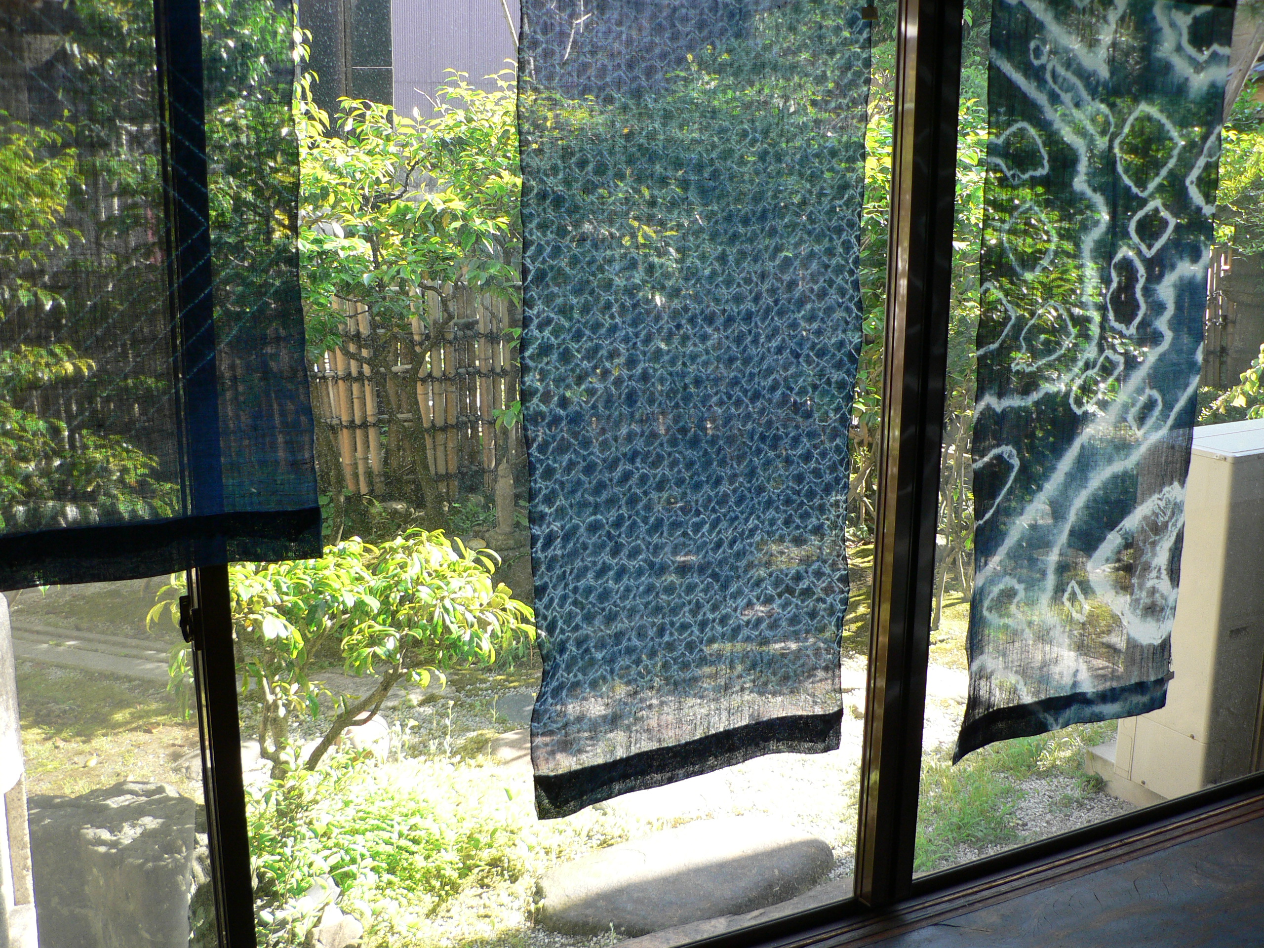 Sunlight through indigo-dyed shibori fabric, a reference photograph
