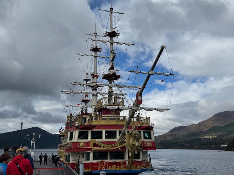 A Hakone pirate ship crossing the blue water of Lake Ashi