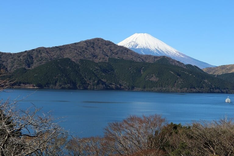 Snow-capped Mount Fuji beyond Lake Ashi