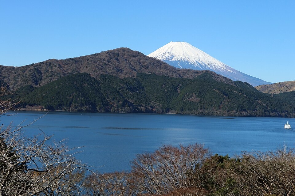 Snow-capped Mount Fuji beyond Lake Ashi