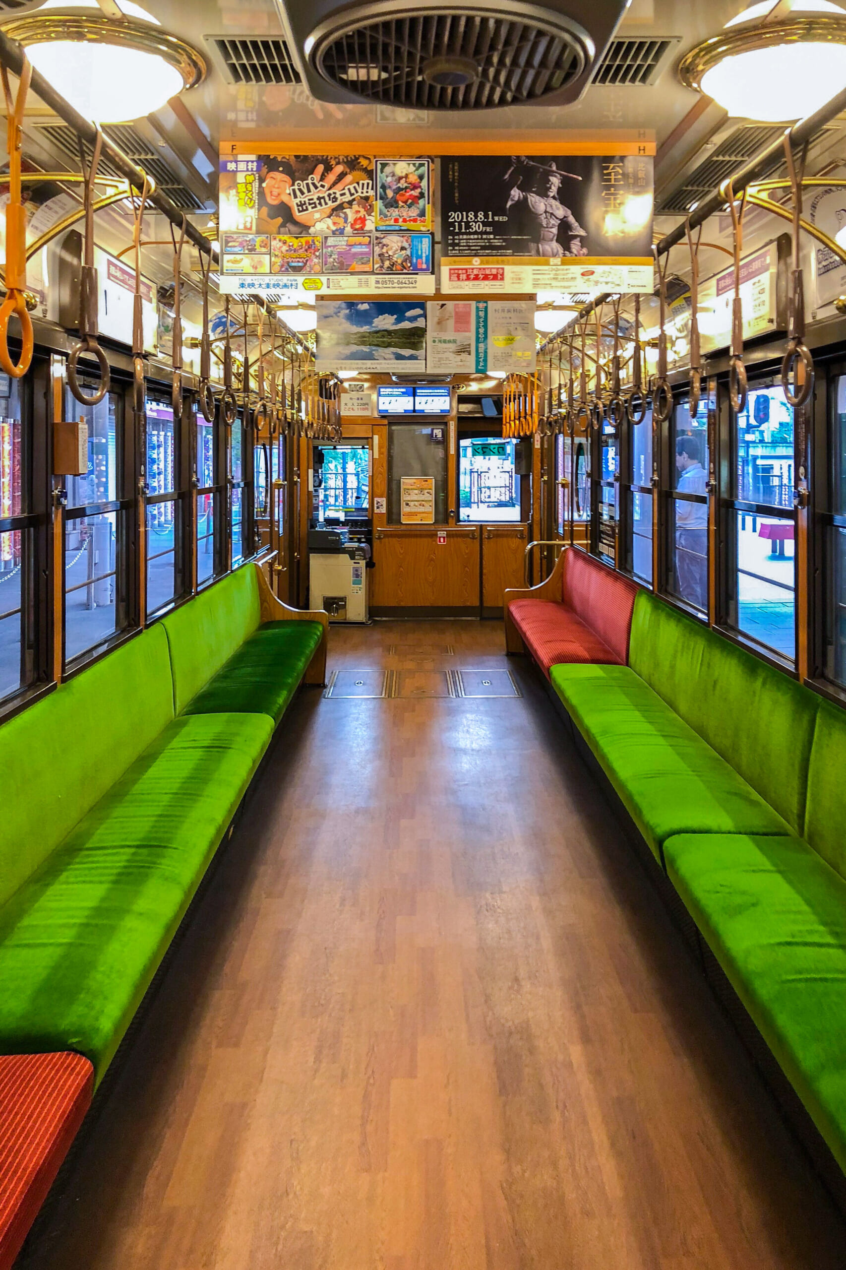 Wooden flooring and seats inside a Kyoto Randen tram