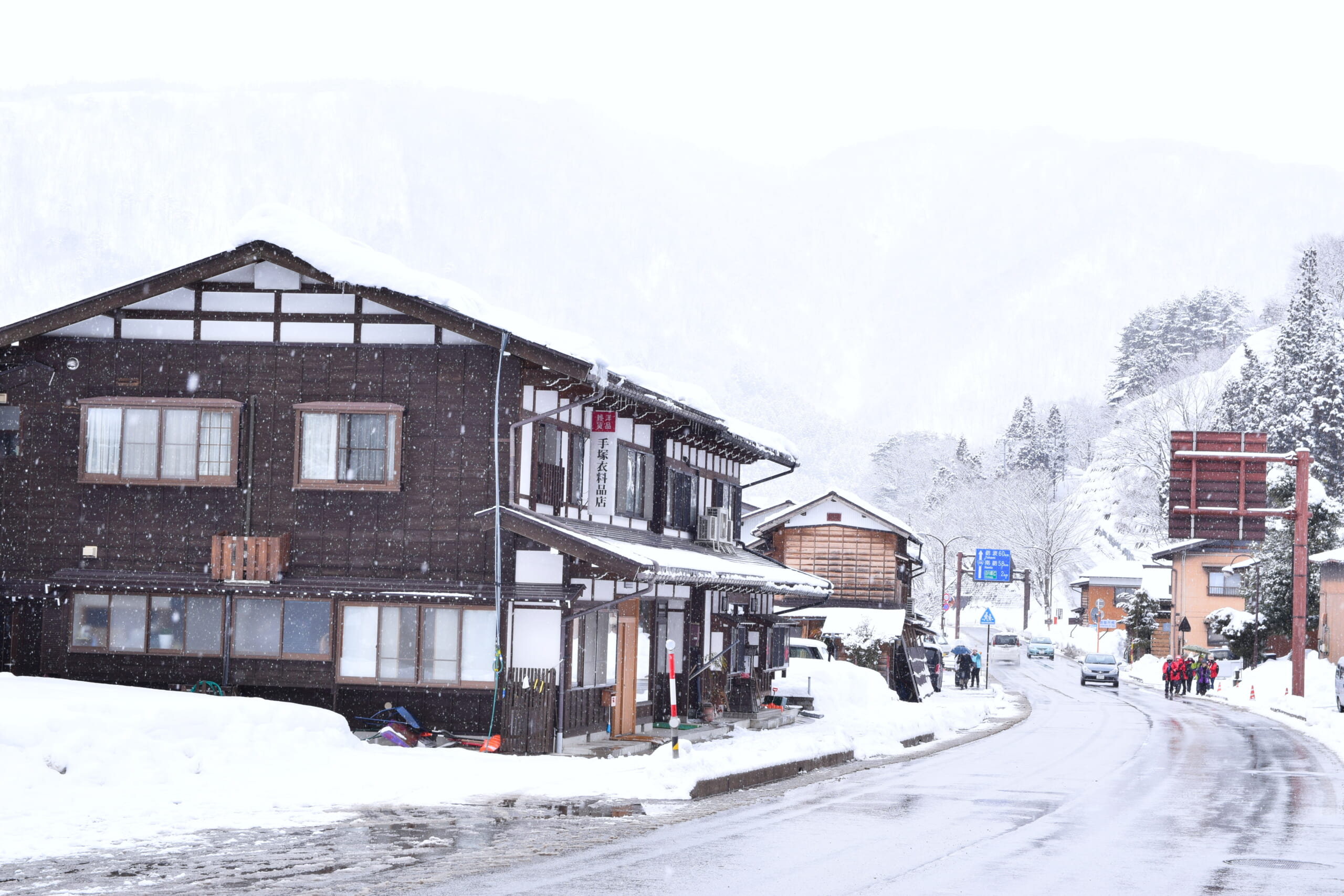 A snowy street and traditional houses in Shirakawa-go
