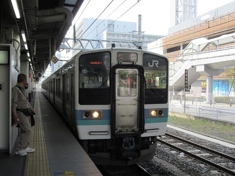 A local train standing at a platform in Kofu Station