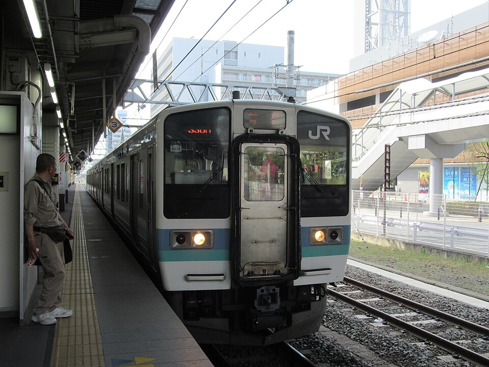 A local train standing at a platform in Kofu Station