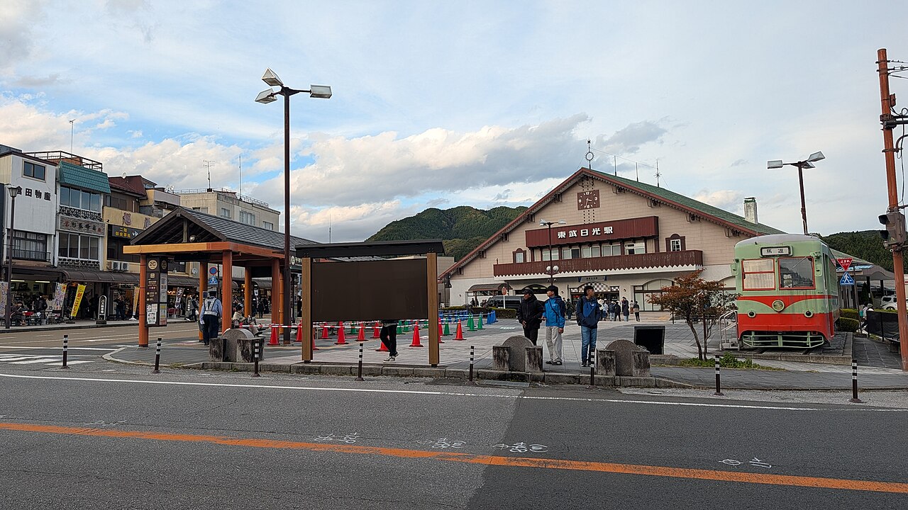 Tobu-Nikko Station and its forecourt with a preserved historic vehicle